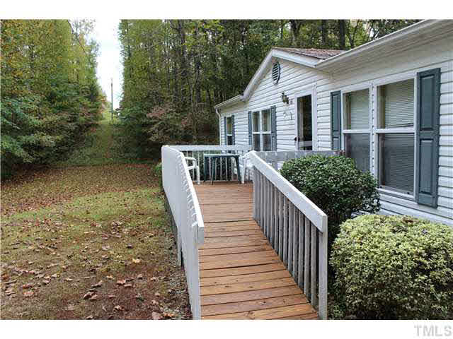 6117 Virgilina Road Roxboro, NC 27574 - Photo 3 of 19 a view of a house with backyard and porch