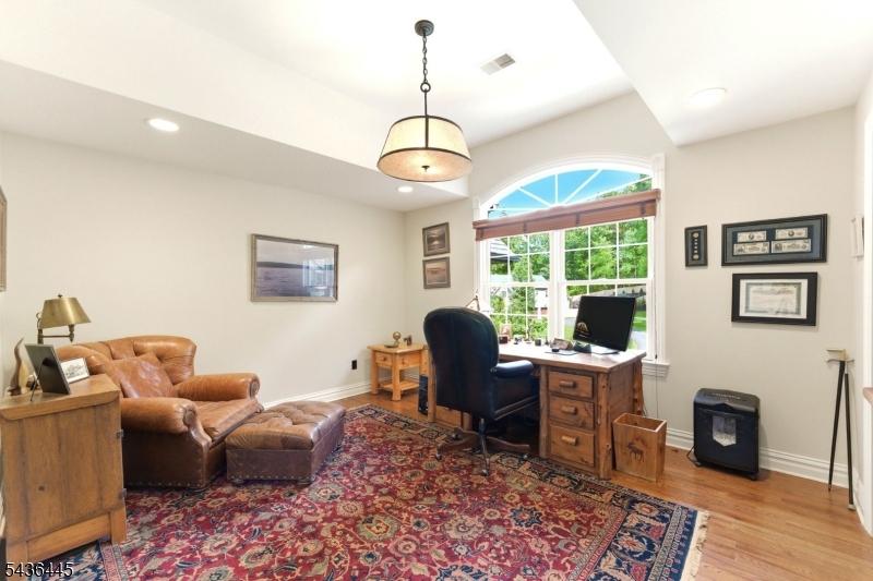 4 Windemere Way Sparta, NJ 07871 - Photo 32 of 50 a living room with furniture a rug and a window