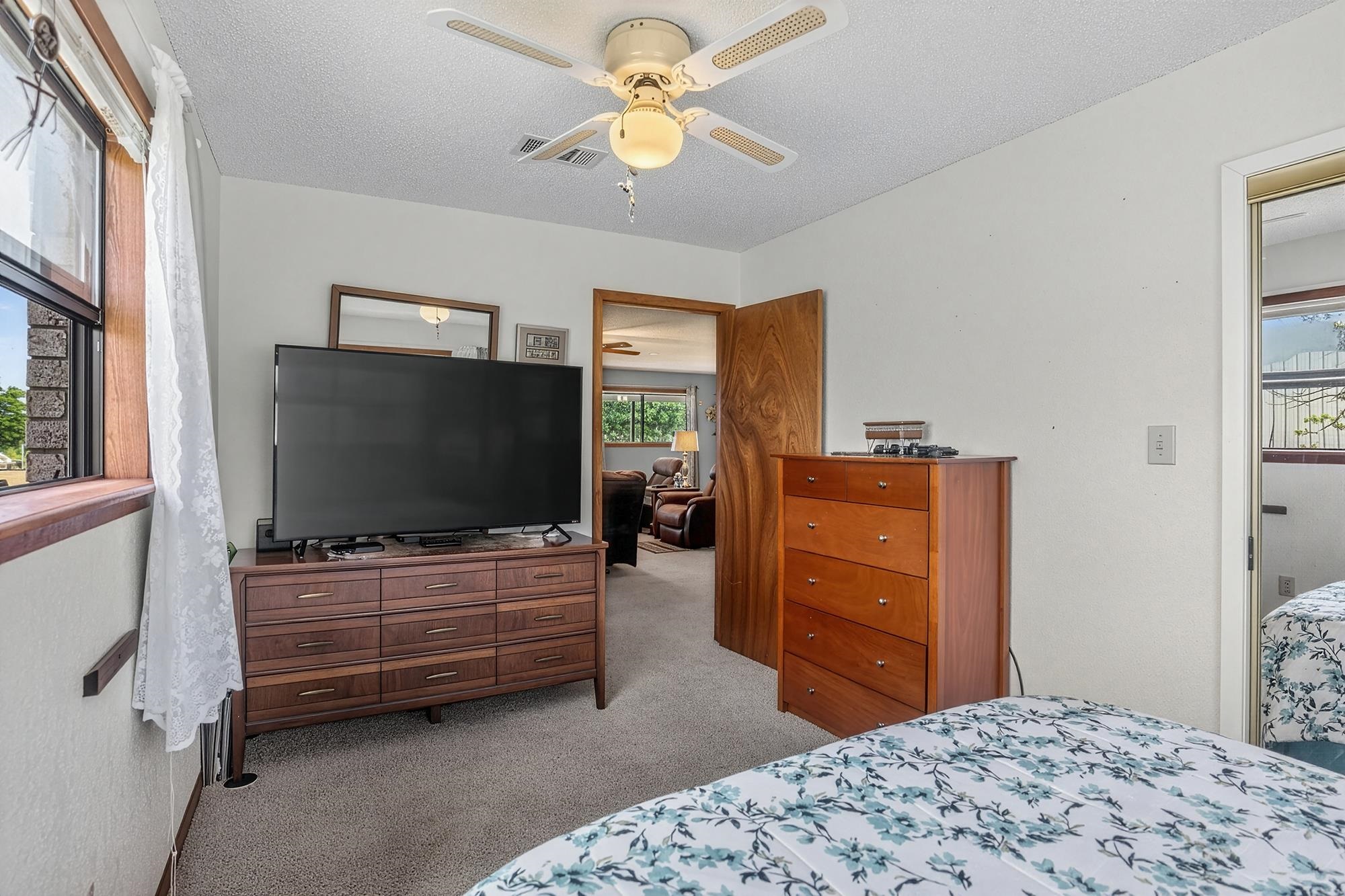 10465 Ranch To Market 1431 Buchanan Dam, TX 78609 - Photo 28 of 29 a bedroom with a bed and television