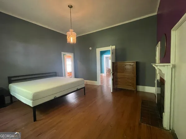 a room with pool table and windows