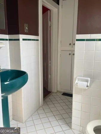 a bathroom with a sink and toilet