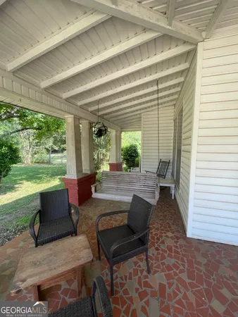 a outdoor living space with furniture and garden view