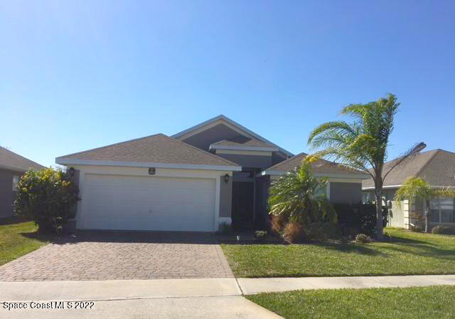 3312 Merrick Avenue Rockledge, FL 32955 - Photo 1 of 30 a front view of a house with garden