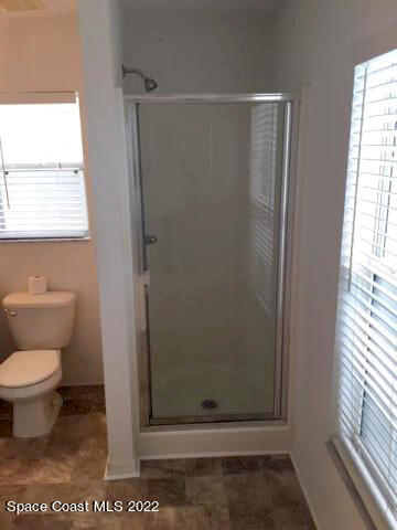 3312 Merrick Avenue Rockledge, FL 32955 - Photo 15 of 30 a bathroom with a toilet and a shower