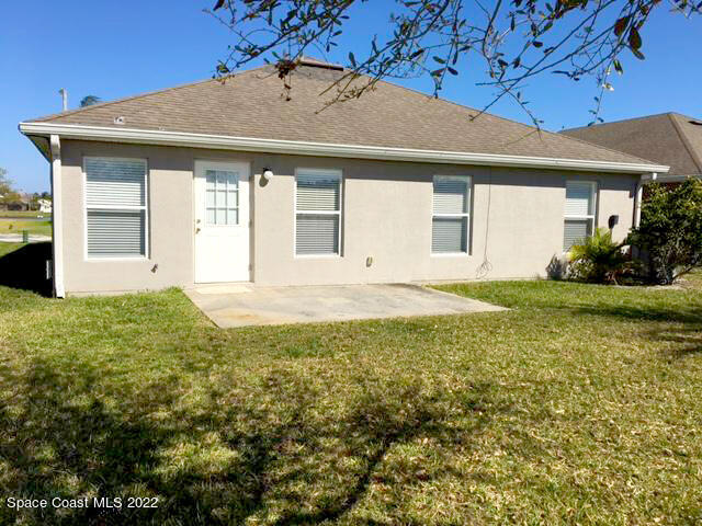 3312 Merrick Avenue Rockledge, FL 32955 - Photo 24 of 30 a front view of a house with garden