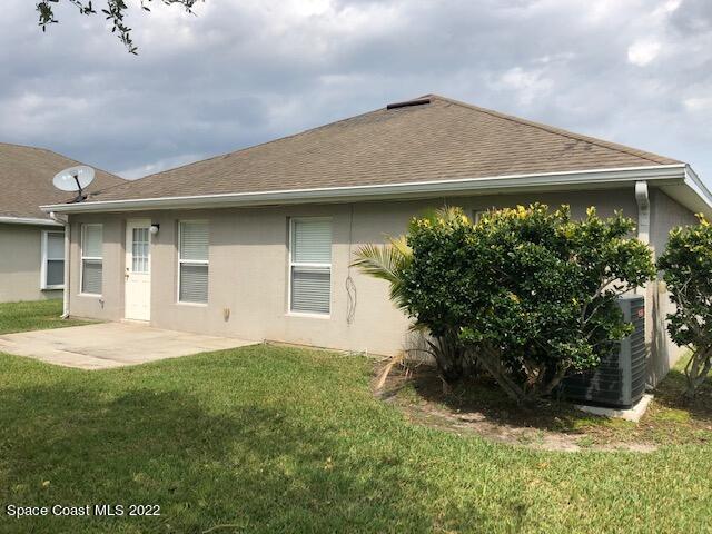 3312 Merrick Avenue Rockledge, FL 32955 - Photo 27 of 30 a front view of house with yard