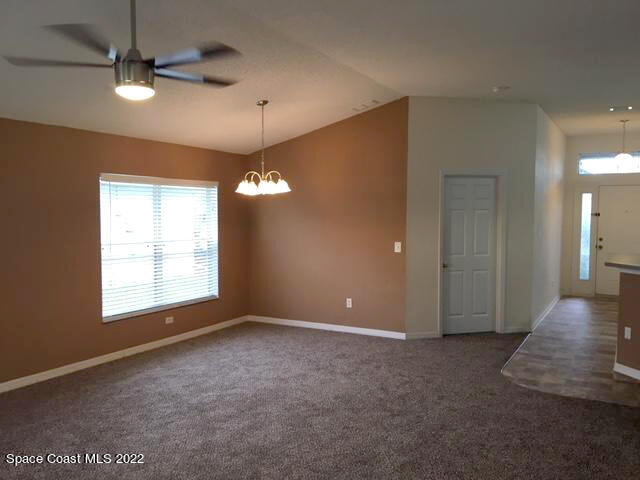 3312 Merrick Avenue Rockledge, FL 32955 - Photo 9 of 30 an empty room with windows and fan