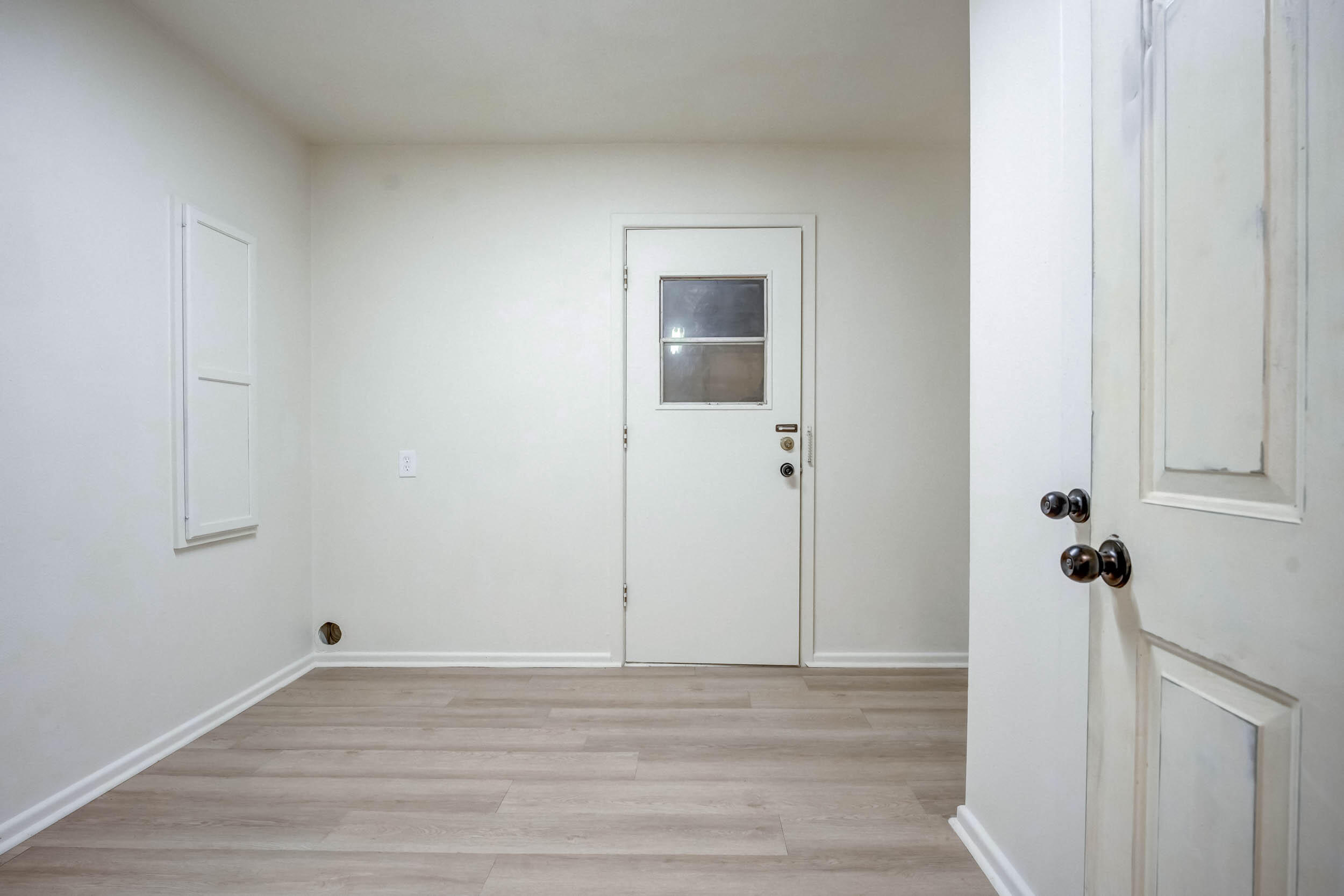2101 64th Street Lubbock, TX 79412 - Photo 28 of 30 a view of a room with wooden floor and a ceiling fan