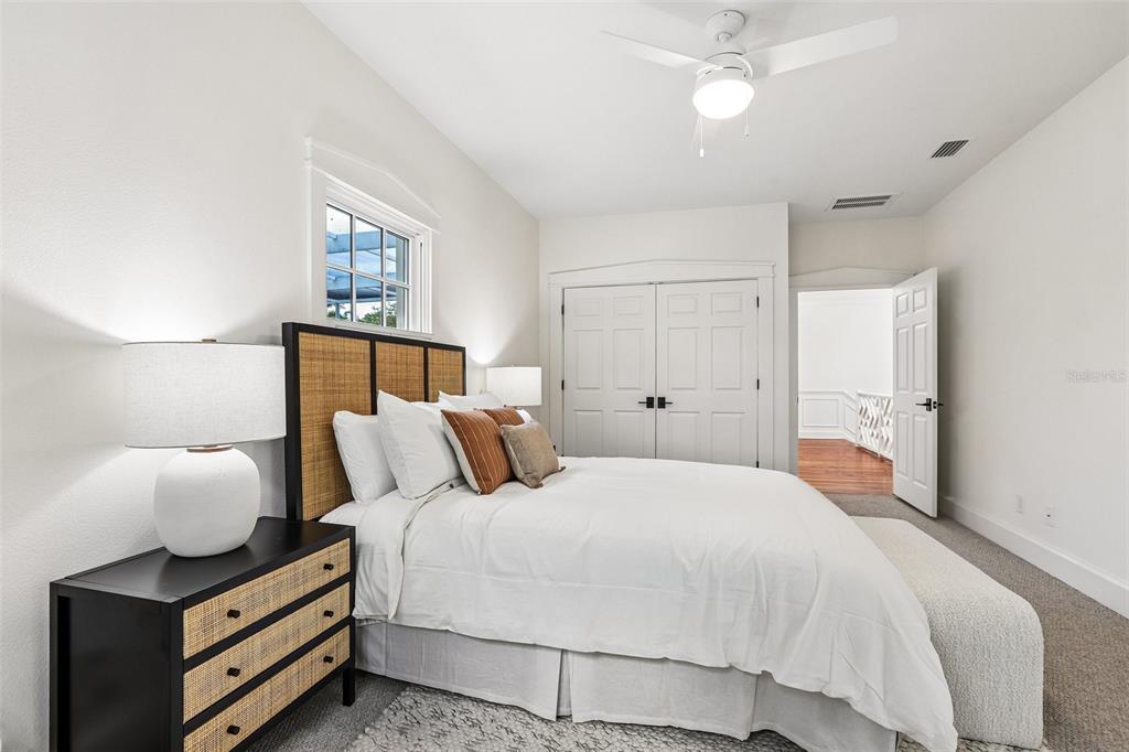 1012 Morfield Lane Brandon, FL 33511 - Photo 64 of 100 a bedroom with a bed and a lamp with window