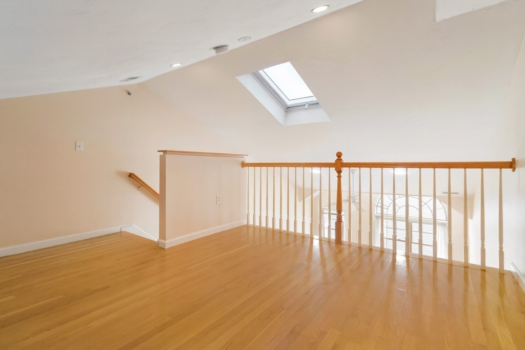 47 Alder Street, Unit 6 Waltham, MA 02453 - Photo 25 of 34 a view of a room with wooden floor