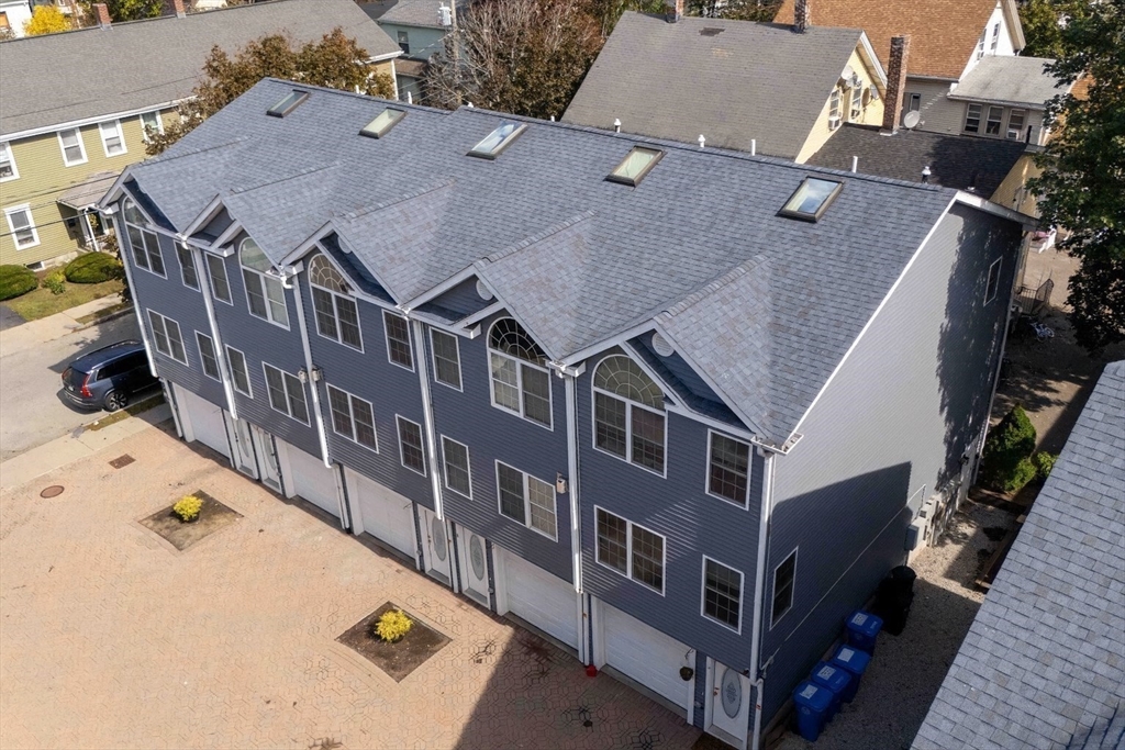 47 Alder Street, Unit 6 Waltham, MA 02453 - Photo 33 of 34 an aerial view of multiple houses with a yard