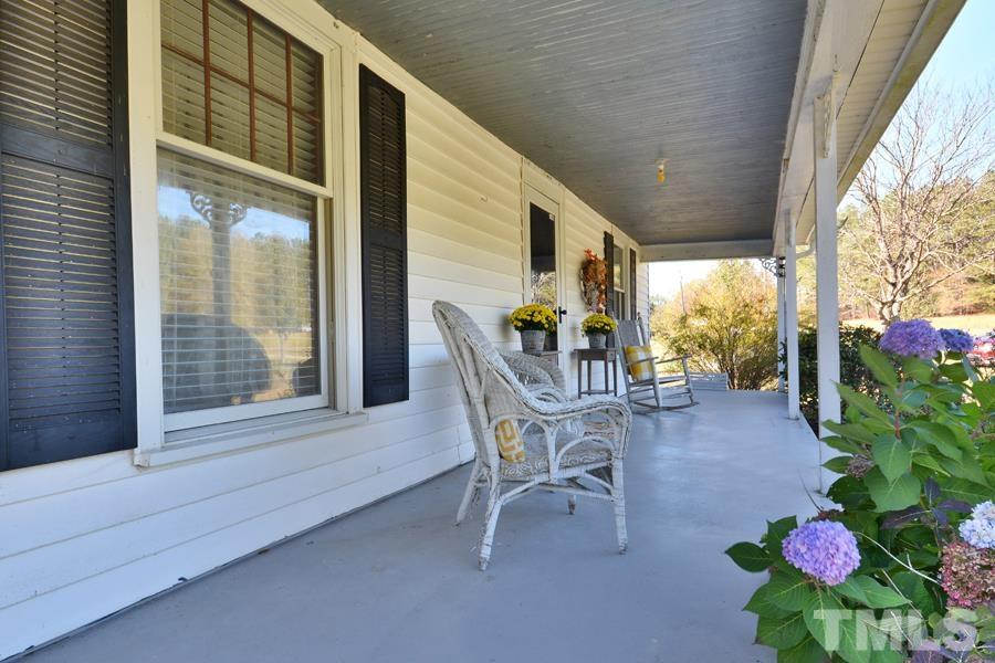 2306 Ellis Chapel Road Bahama, NC 27503 - Photo 5 of 32 a dining room with furniture and garden view