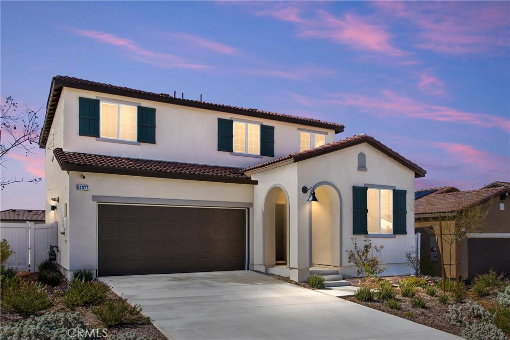 a front view of a house with a garage