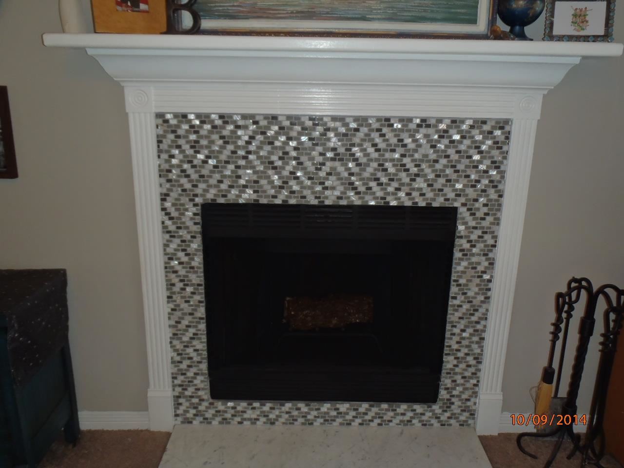 7300 Gordon Evans Road Navarre, FL 32566 - Photo 4 of 10 Beautiful tile surround the wood burning fireplace