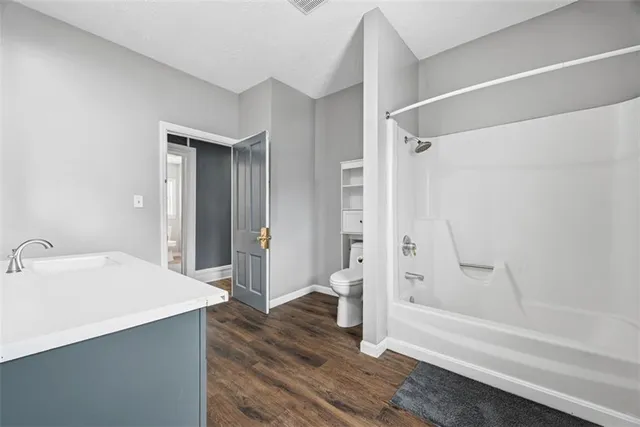 a bathroom with a bathtub and a shower