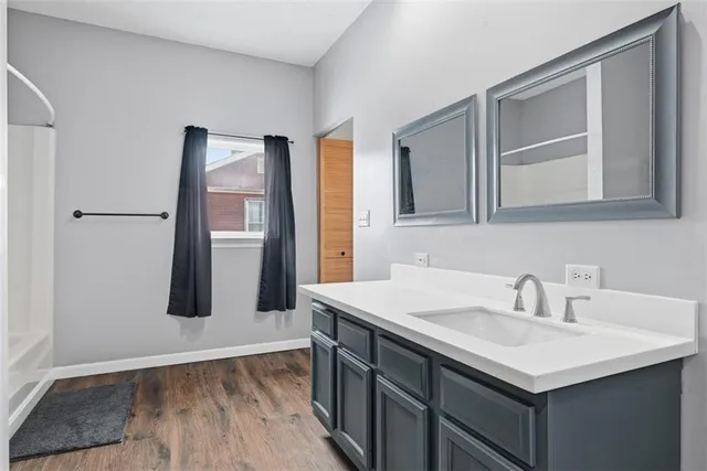 a bathroom with a sink and mirror