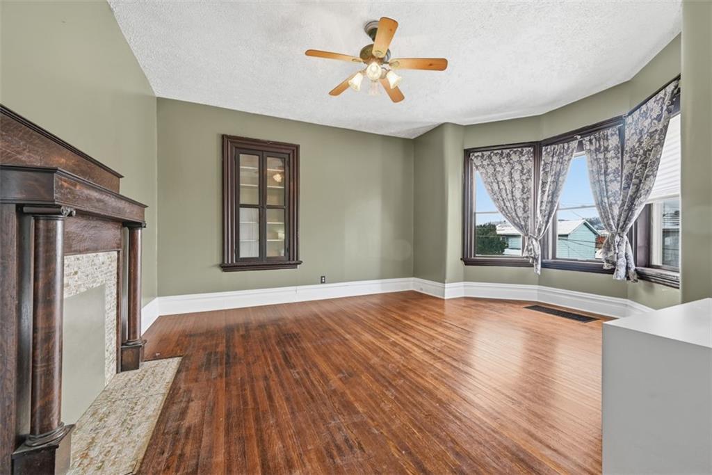901 4th Avenue Freedom, PA 15042 - Photo 4 of 49 a view of livingroom with hardwood floor and a ceiling fan