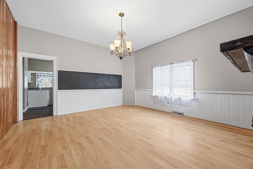901 4th Avenue Freedom, PA 15042 - Photo 9 of 49 a view of a livingroom with a chandelier fan and windows