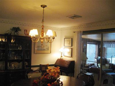 196 Oldham Road Osterville, MA 02655 - Photo 3 of 10 a living room with furniture a chandelier and a window