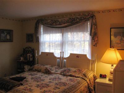 196 Oldham Road Osterville, MA 02655 - Photo 6 of 10 a bed sitting in a bedroom next to a window