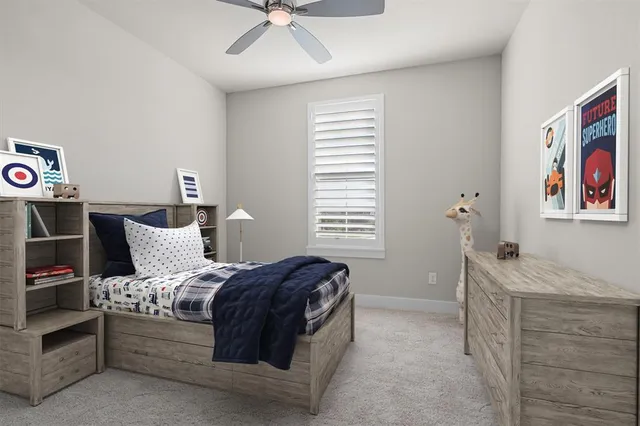 a spacious bedroom with a bed and a chandelier