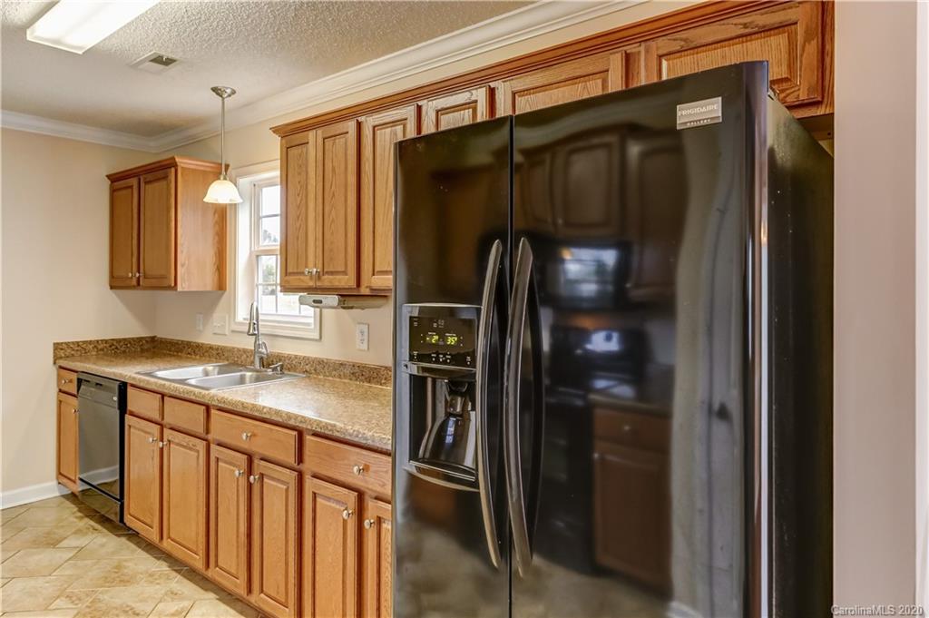 300 Springlake Road York, SC 29745 - Photo 22 of 46 a kitchen with stainless steel appliances granite countertop a refrigerator and a sink