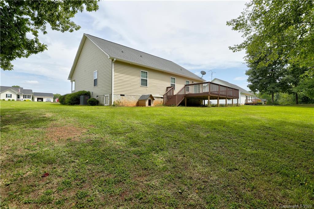 300 Springlake Road York, SC 29745 - Photo 40 of 46 a view of a house with a big yard and large trees