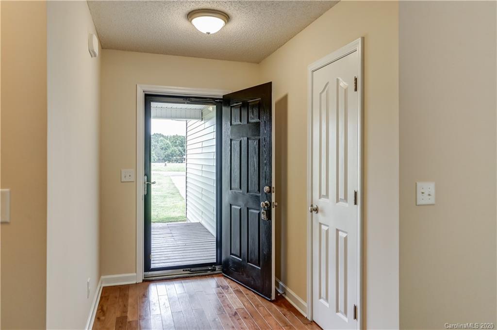 300 Springlake Road York, SC 29745 - Photo 8 of 46 an empty room with wooden floor and a window