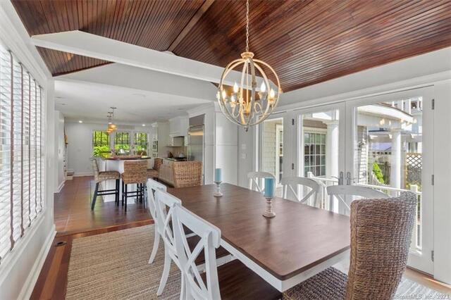 47 Brighton Road Old Lyme, CT 06371 - Photo 13 of 39 a dining room with furniture a chandelier and wooden floor