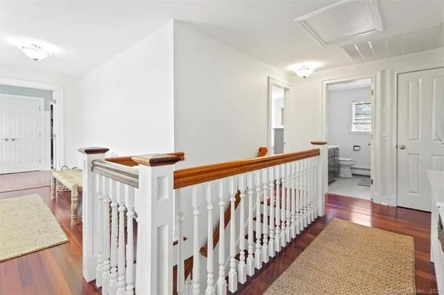 a view of hallway with wooden floor