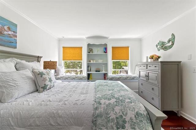 47 Brighton Road Old Lyme, CT 06371 - Photo 20 of 39 a spacious bedroom with a bed and a large window