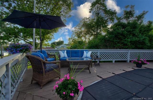 47 Brighton Road Old Lyme, CT 06371 - Photo 34 of 39 an outdoor sitting area with furniture and wooden floor