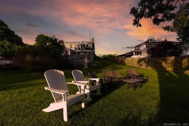 a couple of chairs that are sitting in the grass