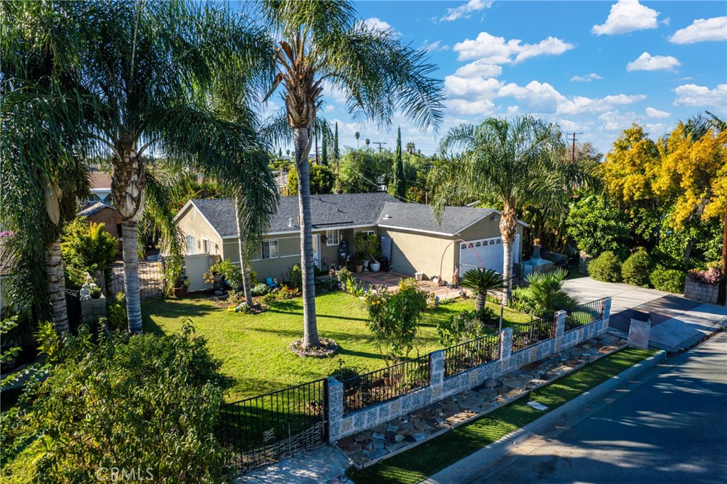 5300 Noble Street Riverside, CA 92503 - Photo 2 of 26 a view of a backyard with couches under an umbrella