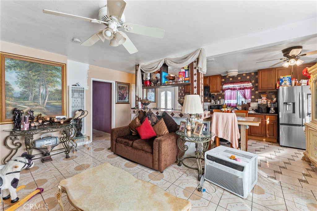 5300 Noble Street Riverside, CA 92503 - Photo 9 of 26 a living room with lots of furniture and a chandelier