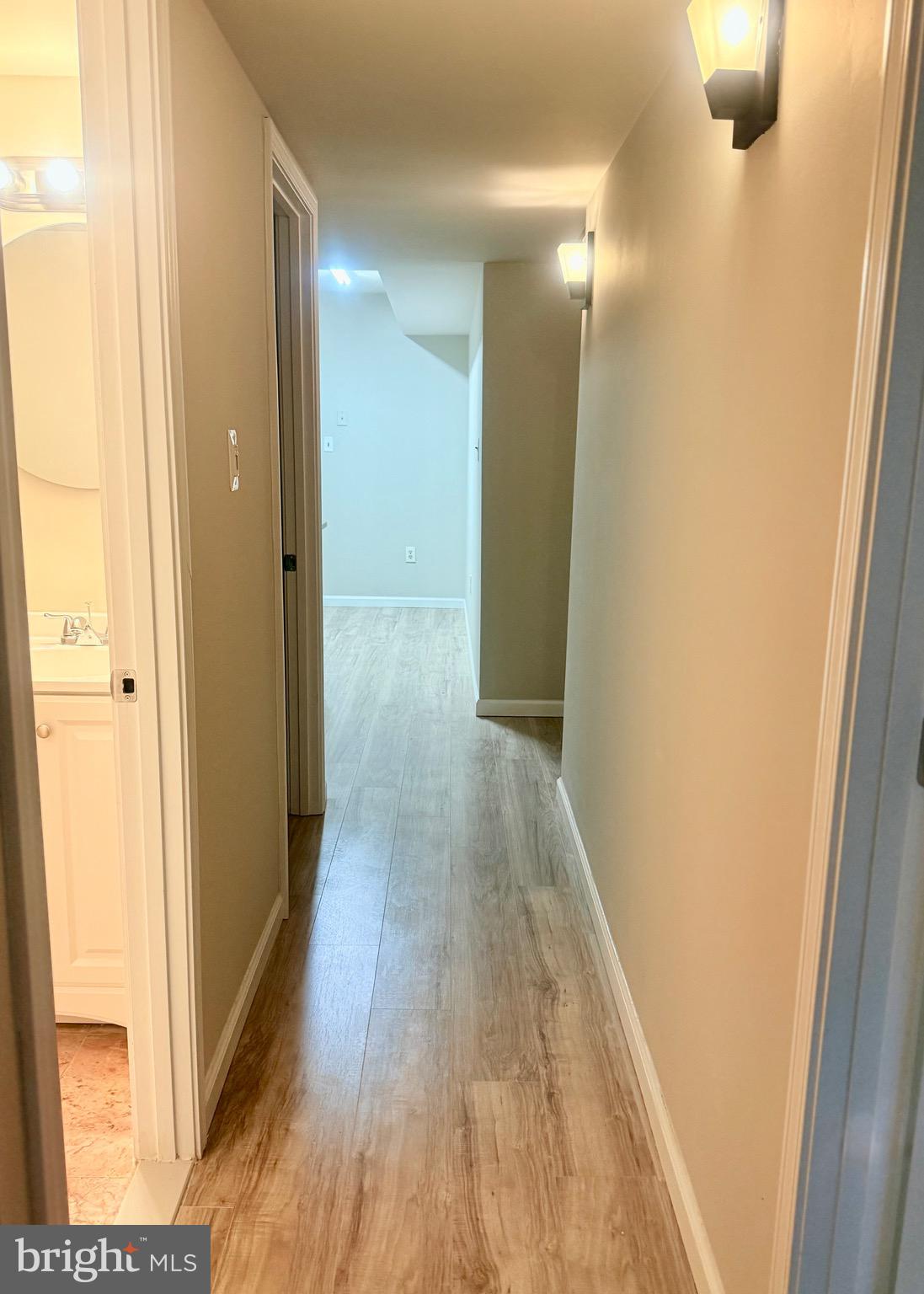 11739 Ledura Court, Unit T7 Reston, VA 20191 - Photo 11 of 17 a view of a hallway with wooden floor
