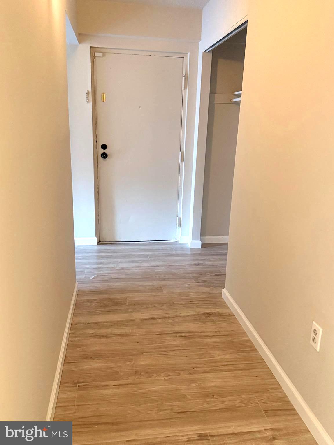 11739 Ledura Court, Unit T7 Reston, VA 20191 - Photo 2 of 17 a view of an empty room with wooden floor
