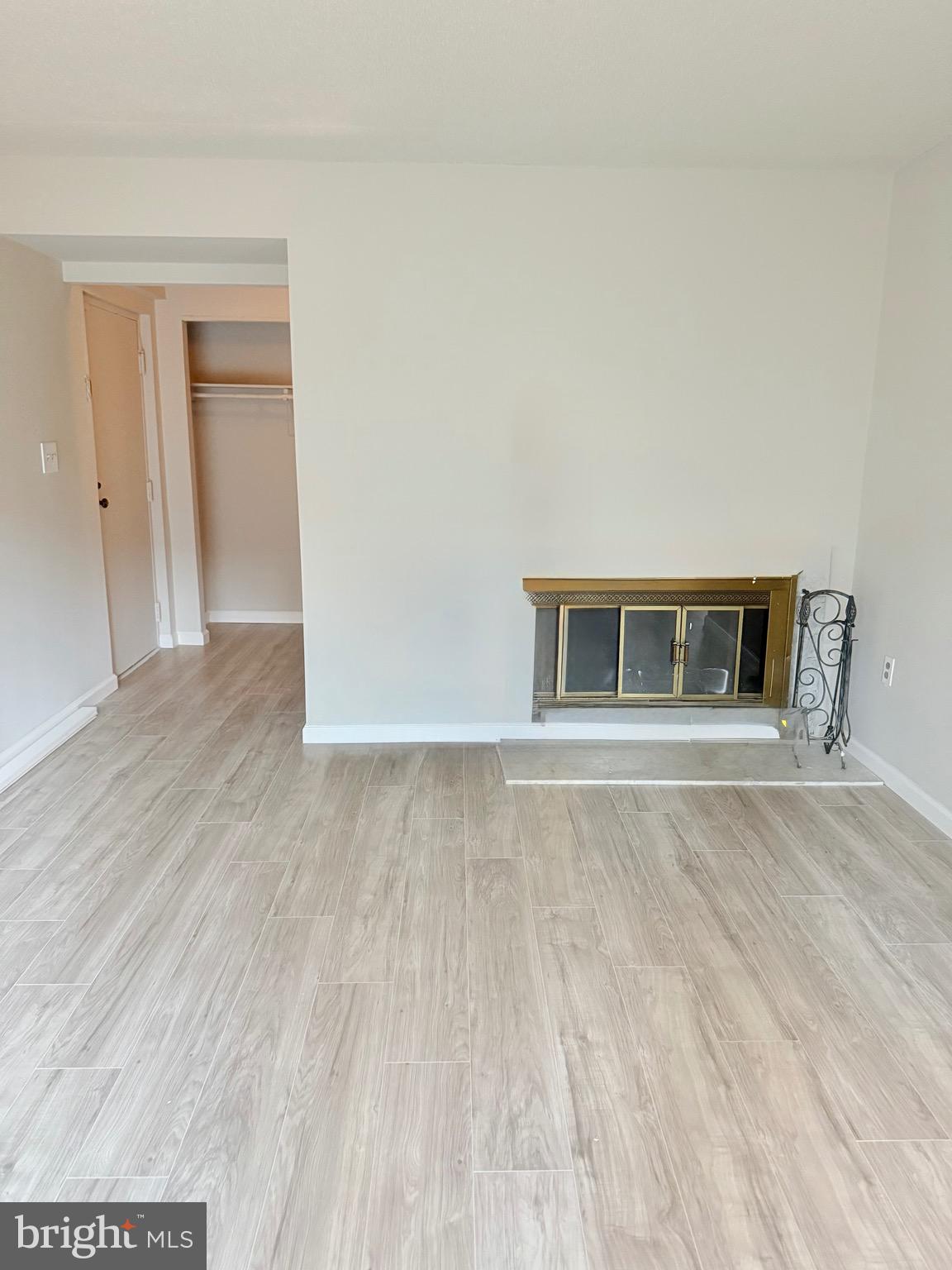 11739 Ledura Court, Unit T7 Reston, VA 20191 - Photo 4 of 17 a view of an empty room with wooden floor and a window