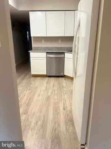 a view of a kitchen with a sink and a microwave