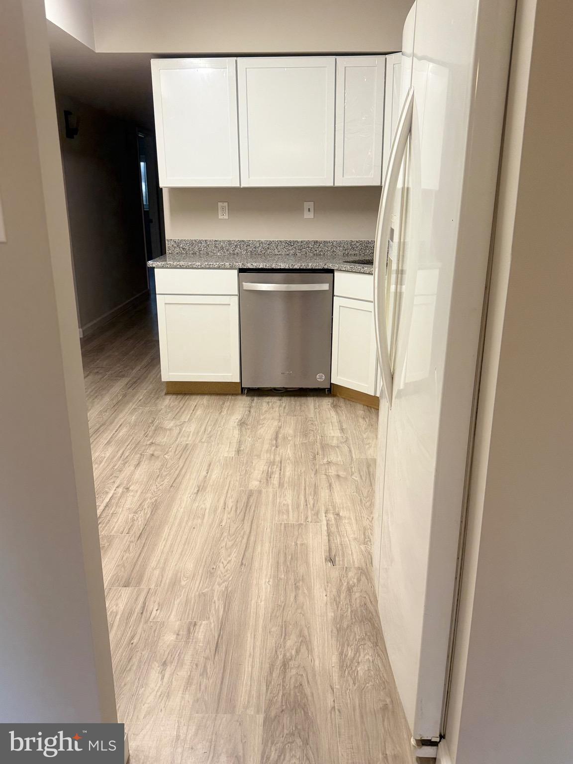 11739 Ledura Court, Unit T7 Reston, VA 20191 - Photo 8 of 17 a view of a kitchen with a sink and a microwave