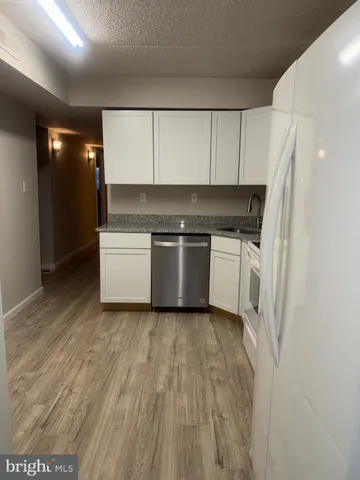 a kitchen with stainless steel appliances a refrigerator and a sink