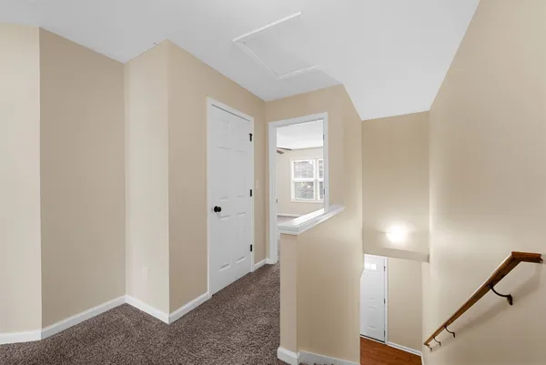 a view of a hallway with front door