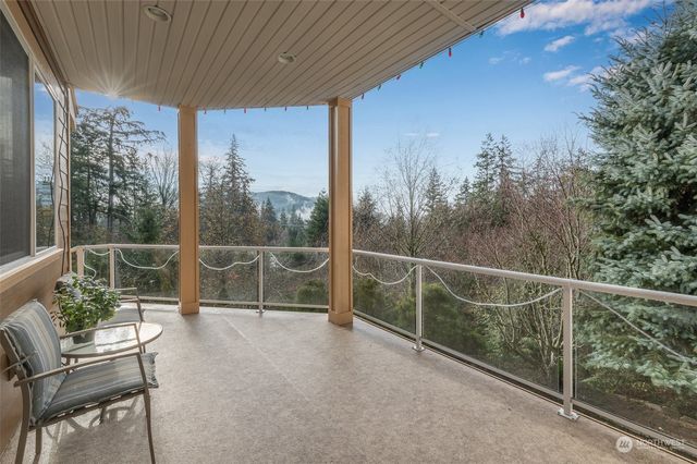 a view of a chair and table in the balcony