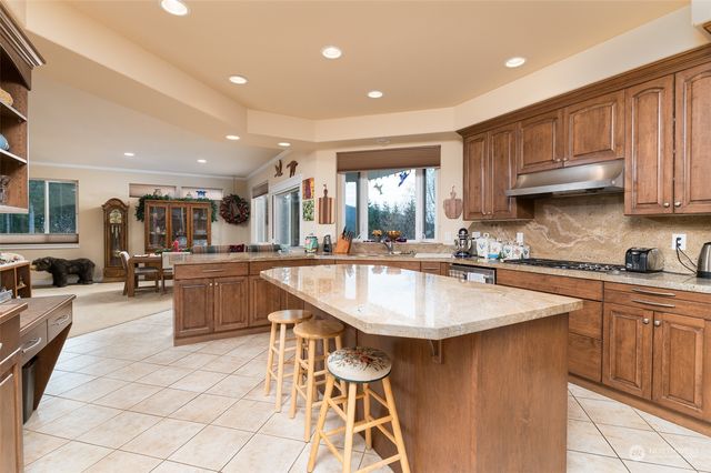 a kitchen with counter top space a sink and appliances