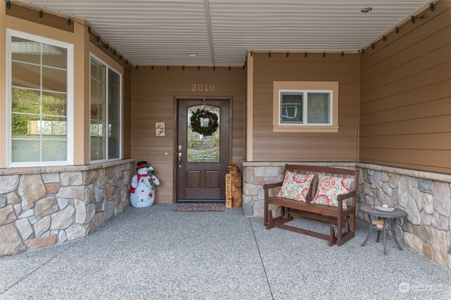 a view of a room with window and furniture