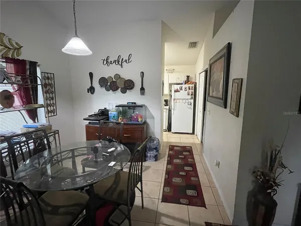 a living room with furniture and a rug