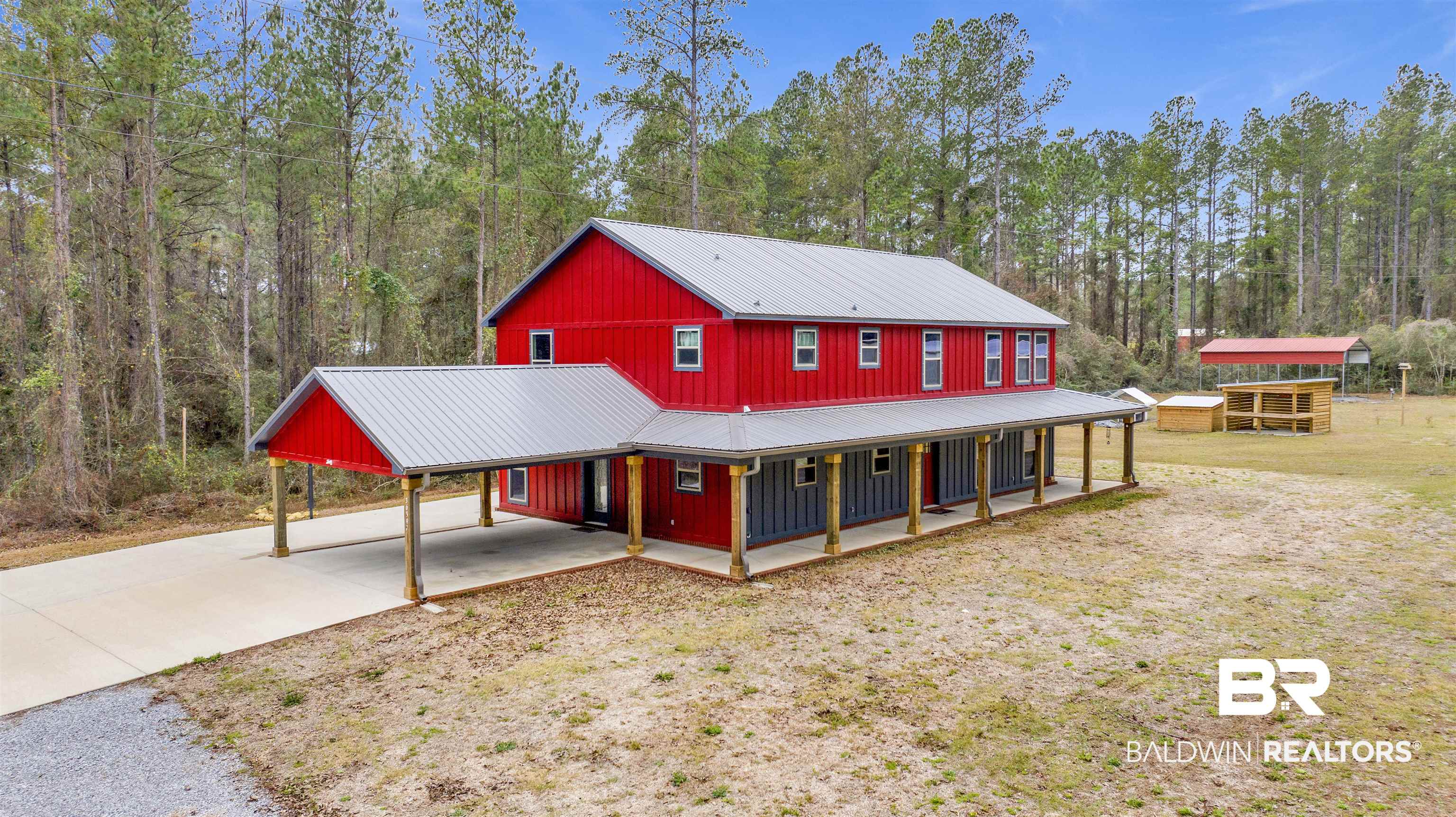 36397 Alexandria Trail Stapleton, AL 36578 - Photo 1 of 65 Farmhouse featuring a carport, concrete driveway, a porch, and a metal roof