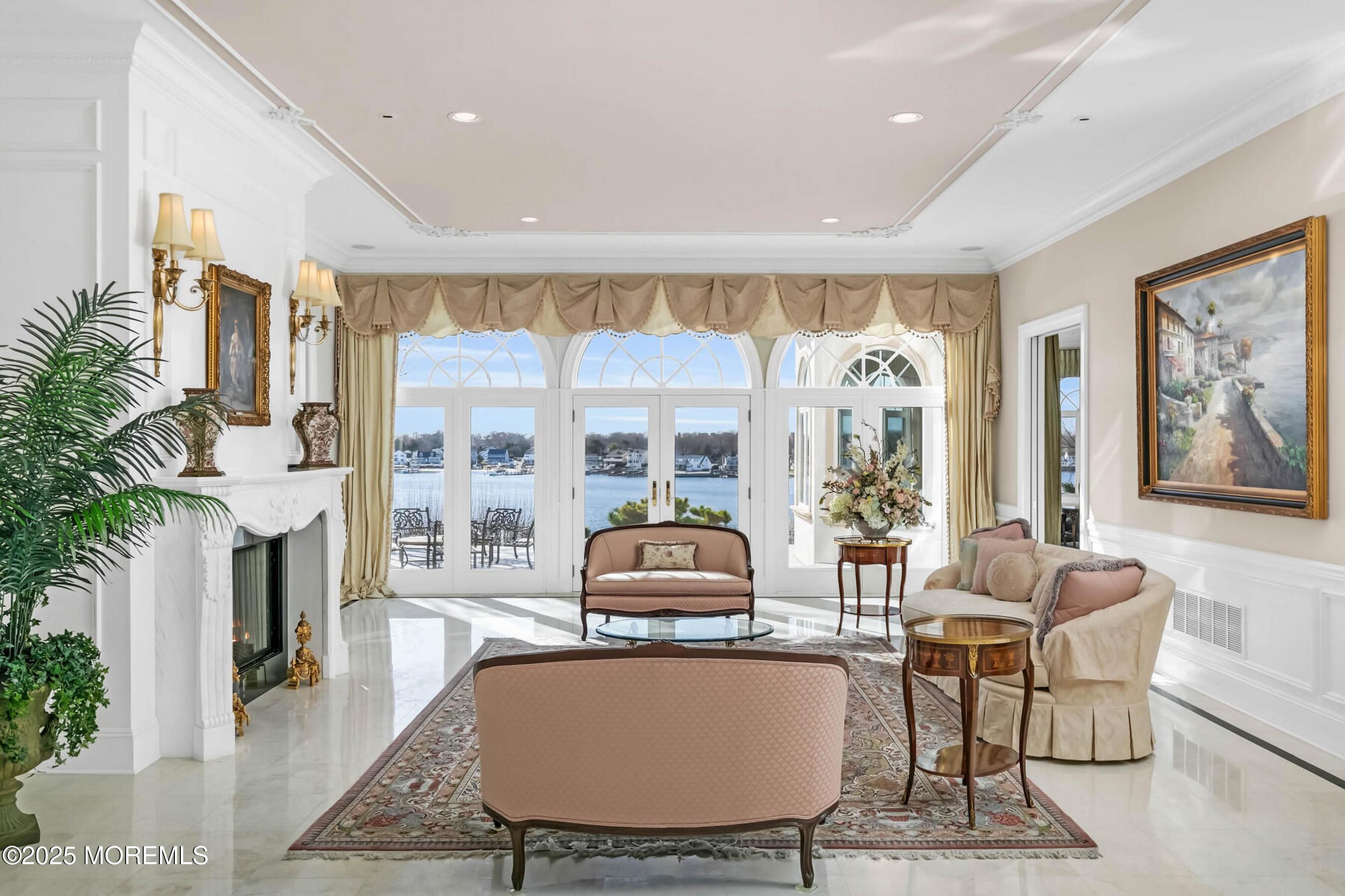 1015 Forrest Road Brielle, NJ 08730 - Photo 16 of 61 a living room with furniture a large window and a dining table