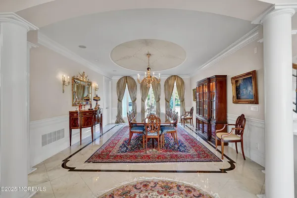 a very nice looking dining room with a table and chairs