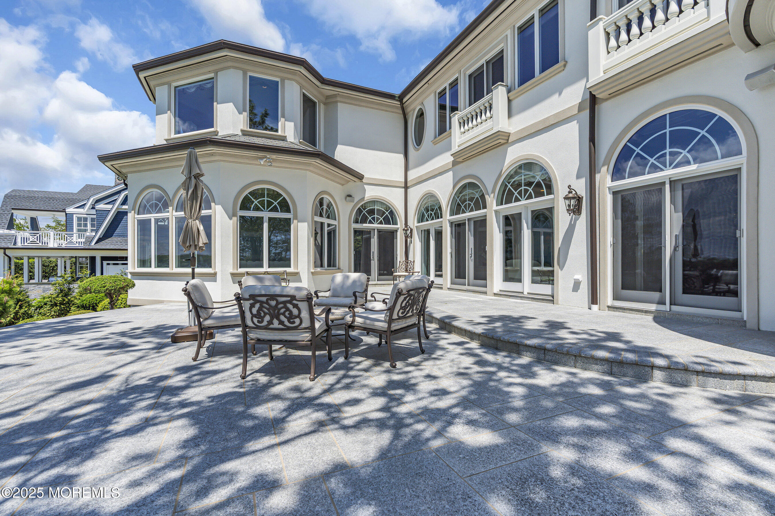 1015 Forrest Road Brielle, NJ 08730 - Photo 25 of 61 a view of a building with a dining table and chairs